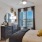 a bedroom with a bed and a mirror