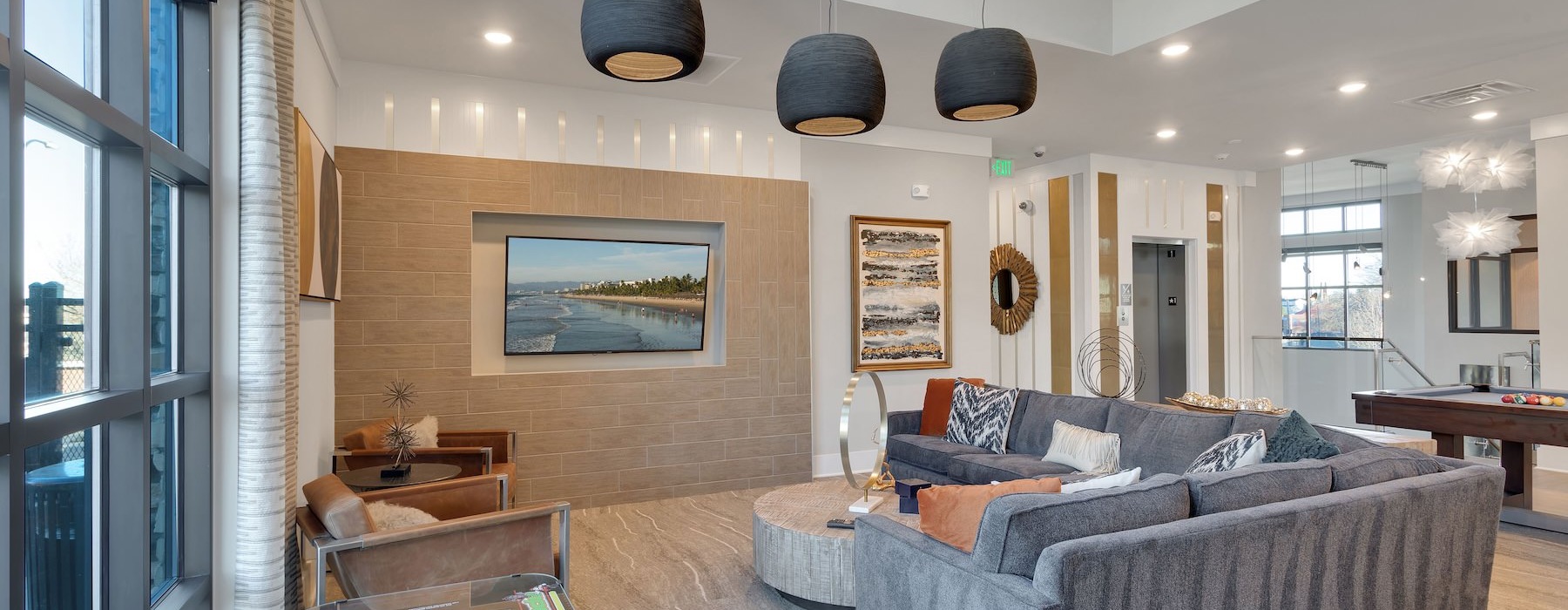 a clubhouse room with a couch and a table