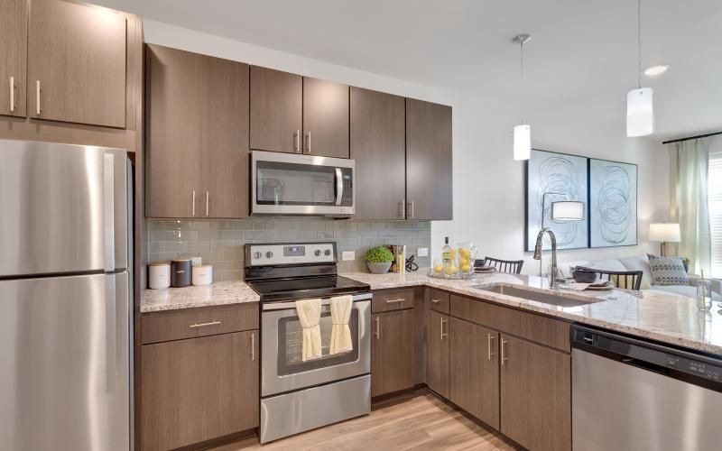 a kitchen with wooden cabinets